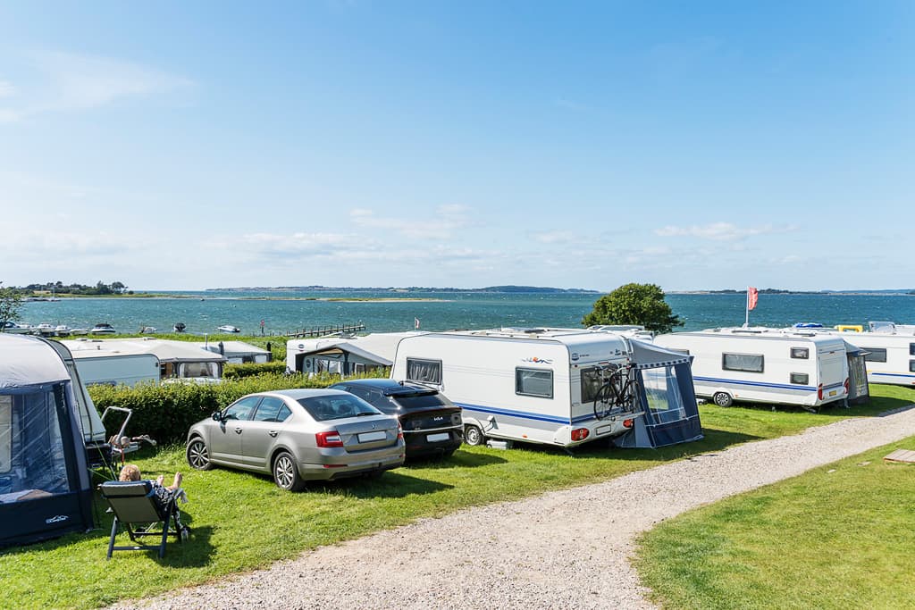 Camping pitches with electricity water and drainage at Bøjden Strand