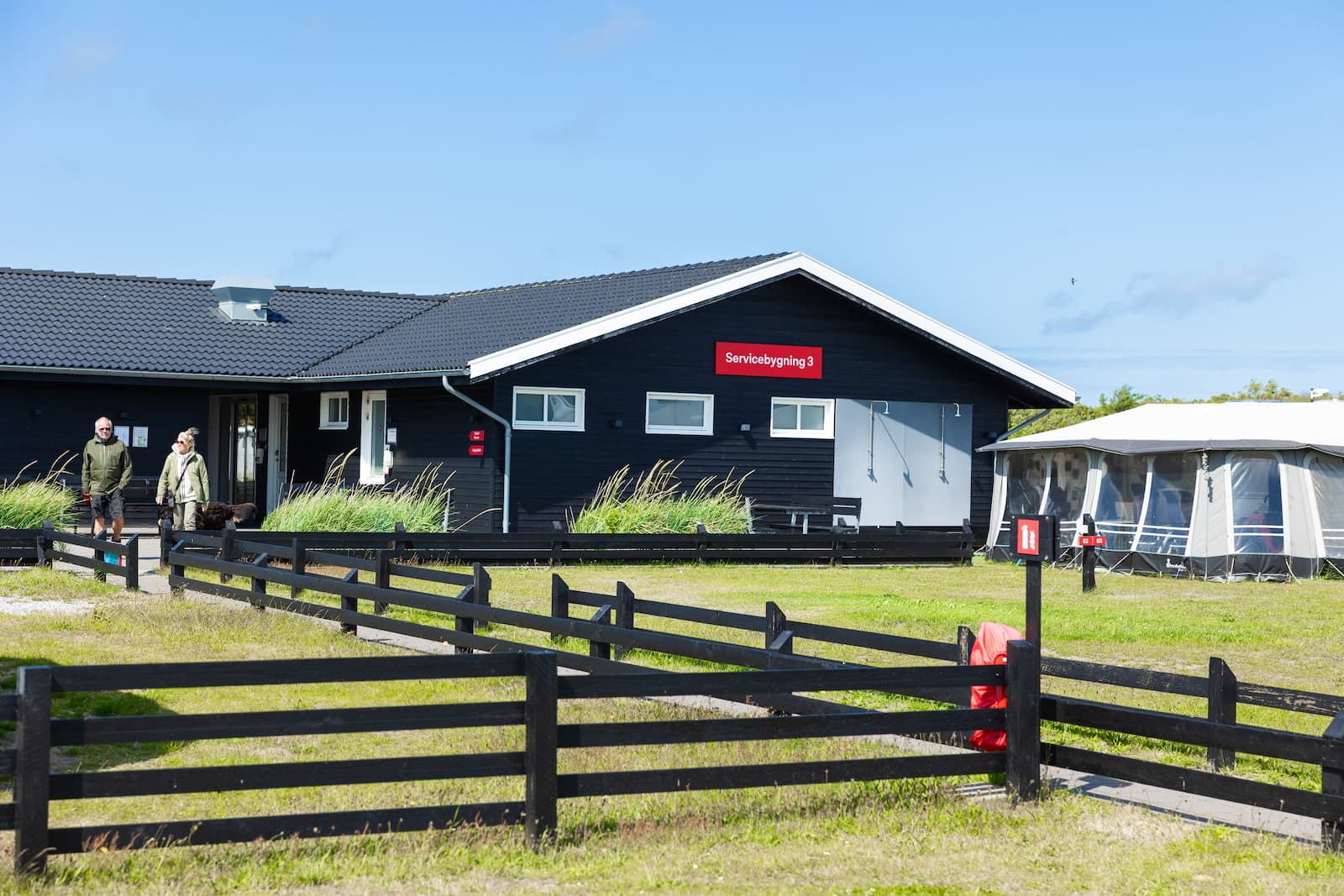 Modern service building at First Camp Grenen Strand with showers and kitchen facilities