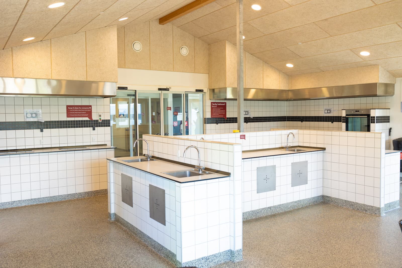 Service building lounge area at First Camp Grenen Strand with seating and TV