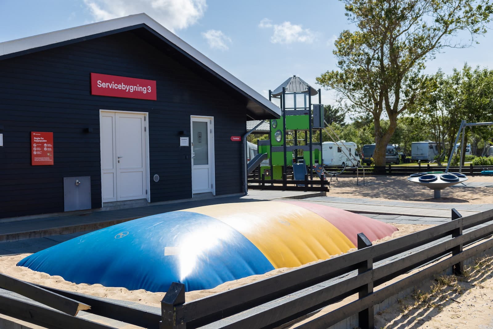 Interior of a service building with family bathrooms at First Camp Grenen Strand