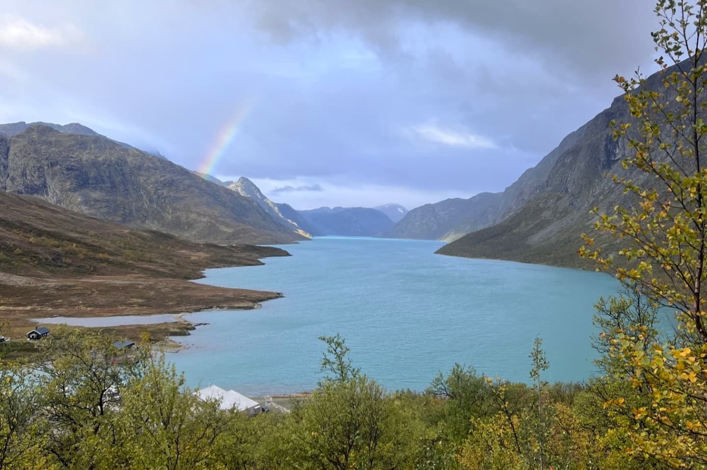 Boat on Lake Bygdin in Jotunheimen near Beitostølen surrounded by mountains