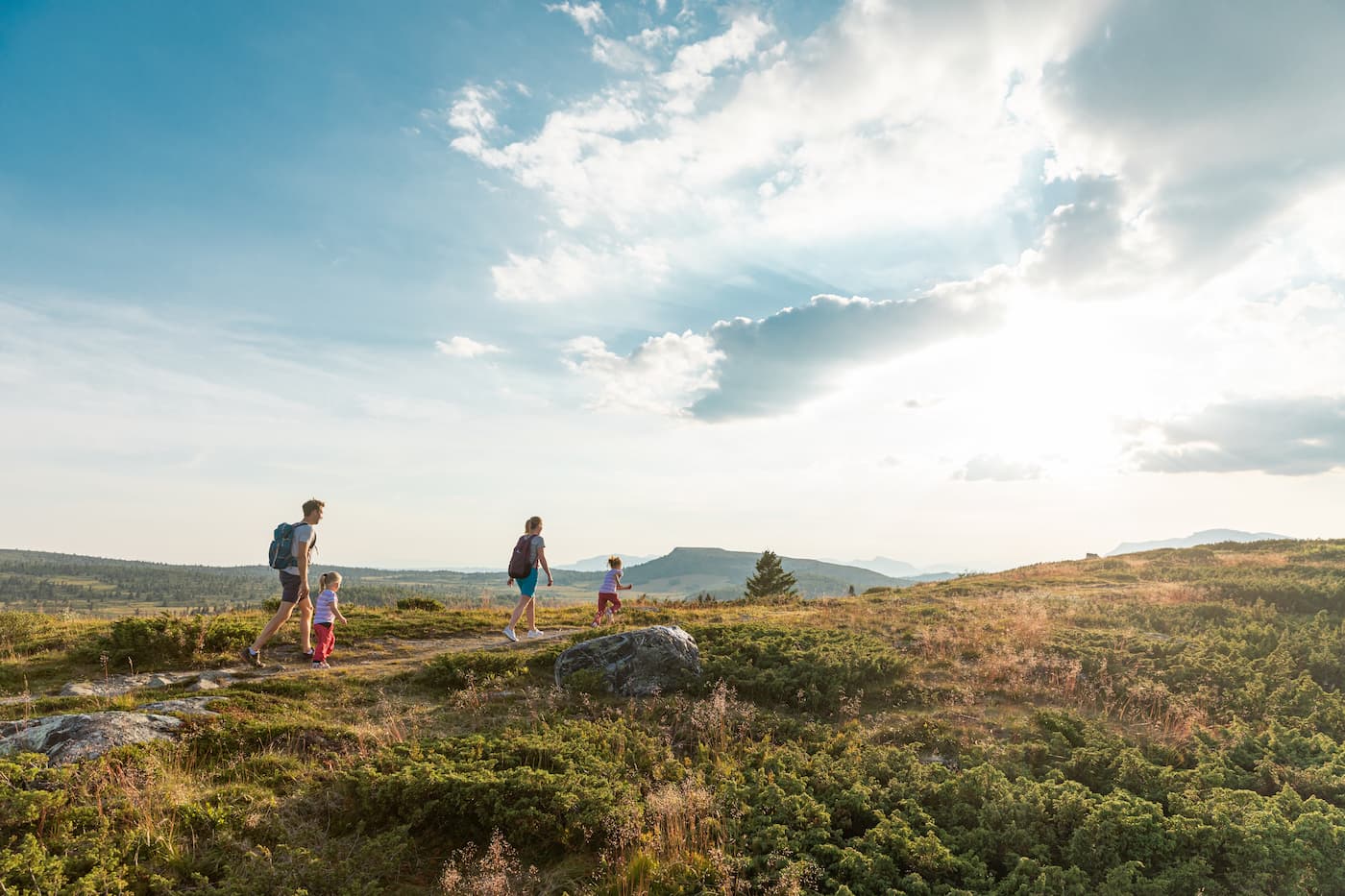 Hikers on Bitihorn near Beitostølen with views over Jotunheimen and Lake Bygdin