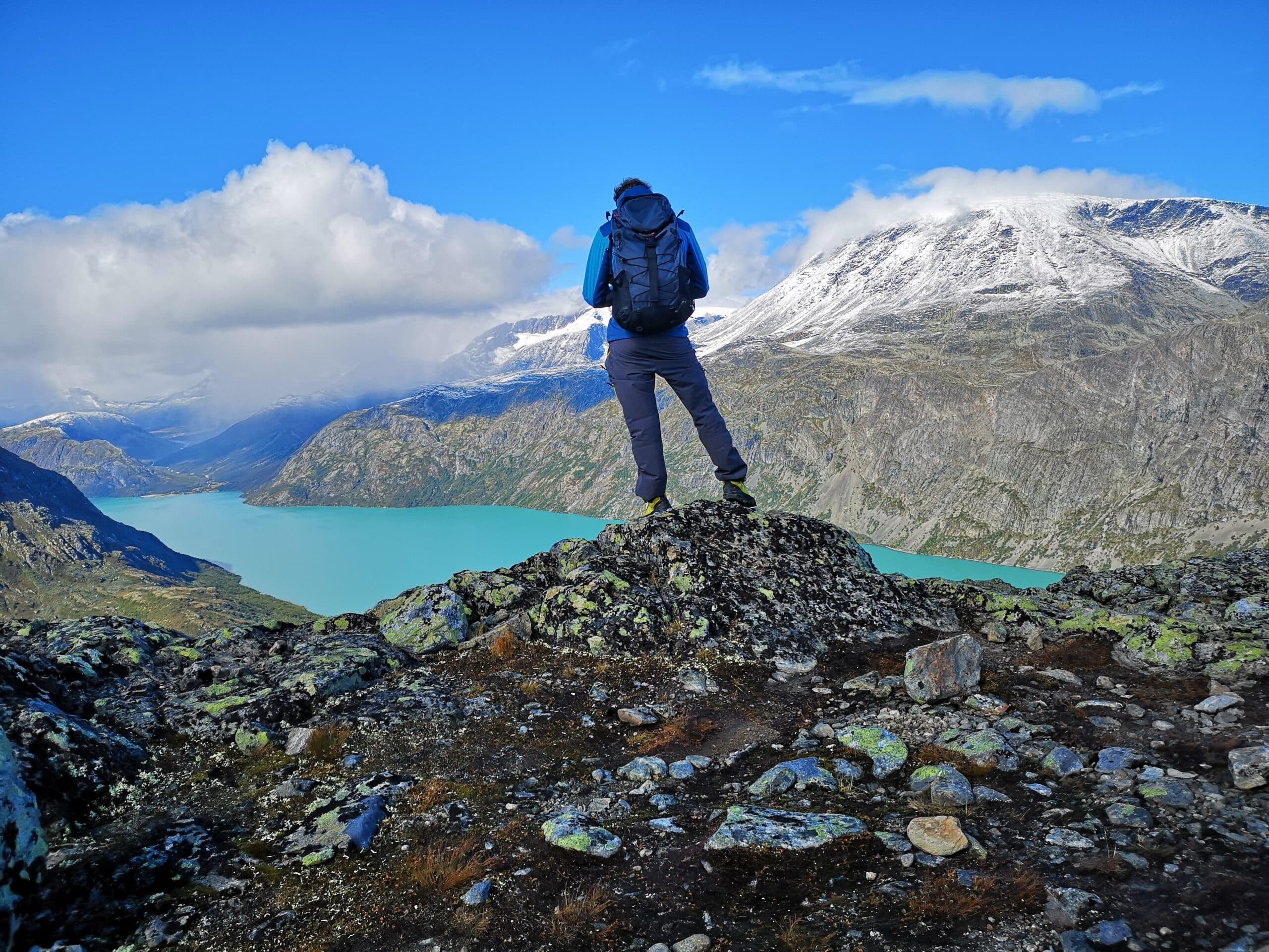 Hikers on the Besseggen ridge near Beitostølen with views of Gjende and Bessvatnet